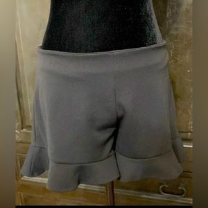 Peach Love black ruffles skorts. Size medium